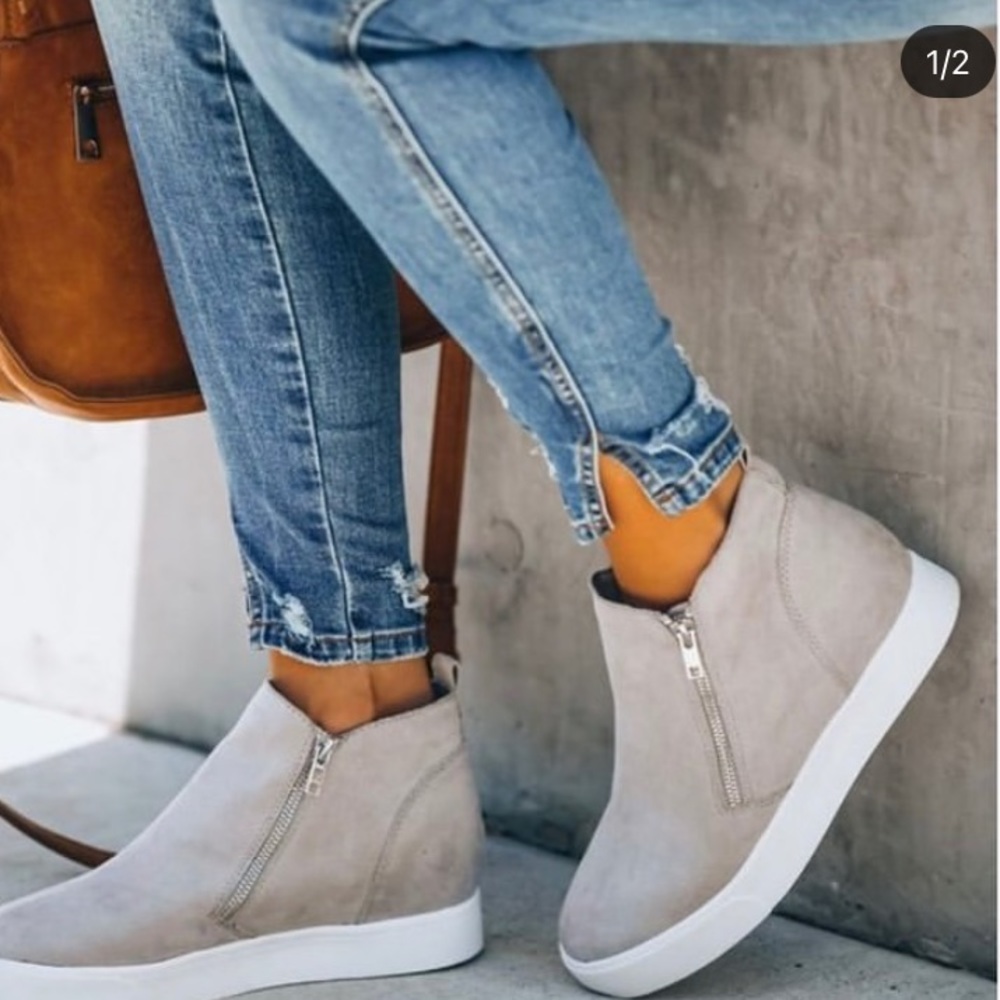 Gray zip up booties.